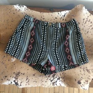 Angie’s mid rise size medium Aztec print shorts.